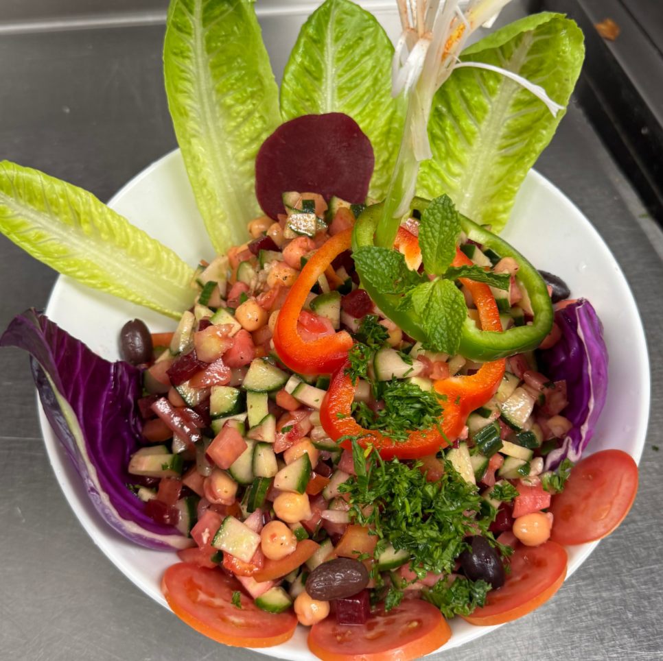 Fresh Arabic salad with romaine, tomato and cucumber