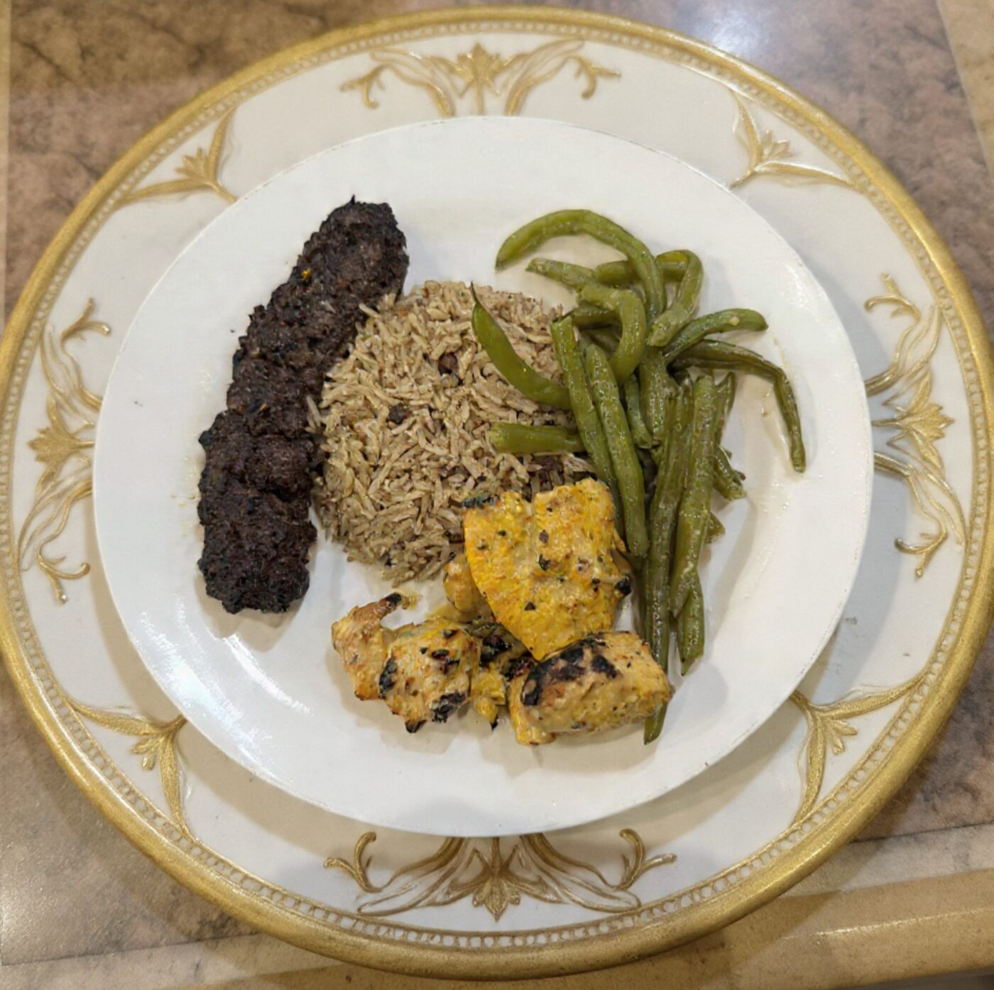 Kafta kabob and chicken tikka with rice and green beans