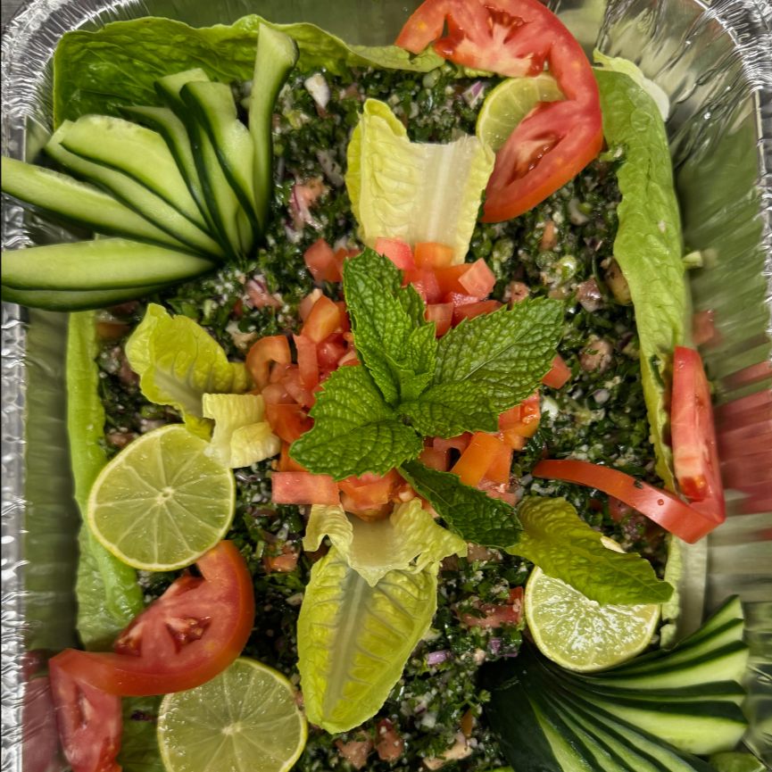Tabbouli party tray with tomato, cucumber and lime
